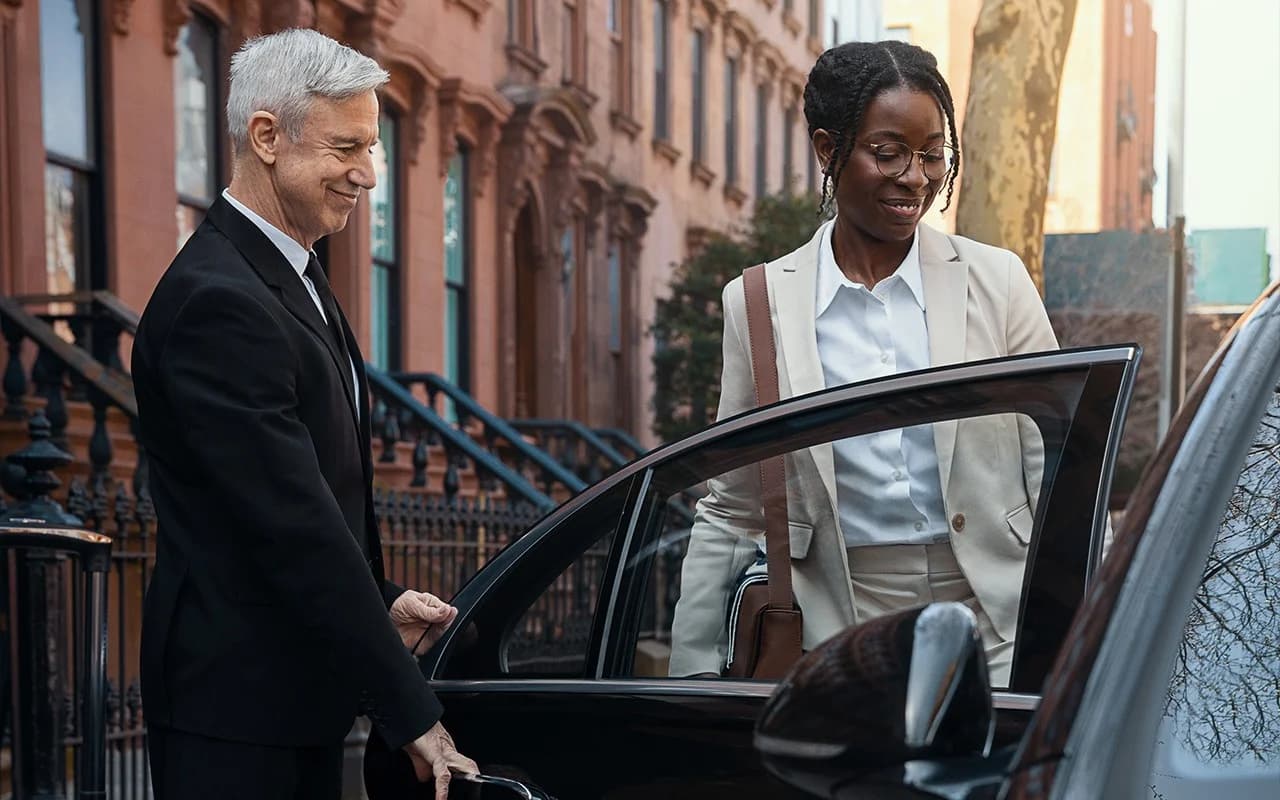 Chauffeur greeting airport transfer passengers